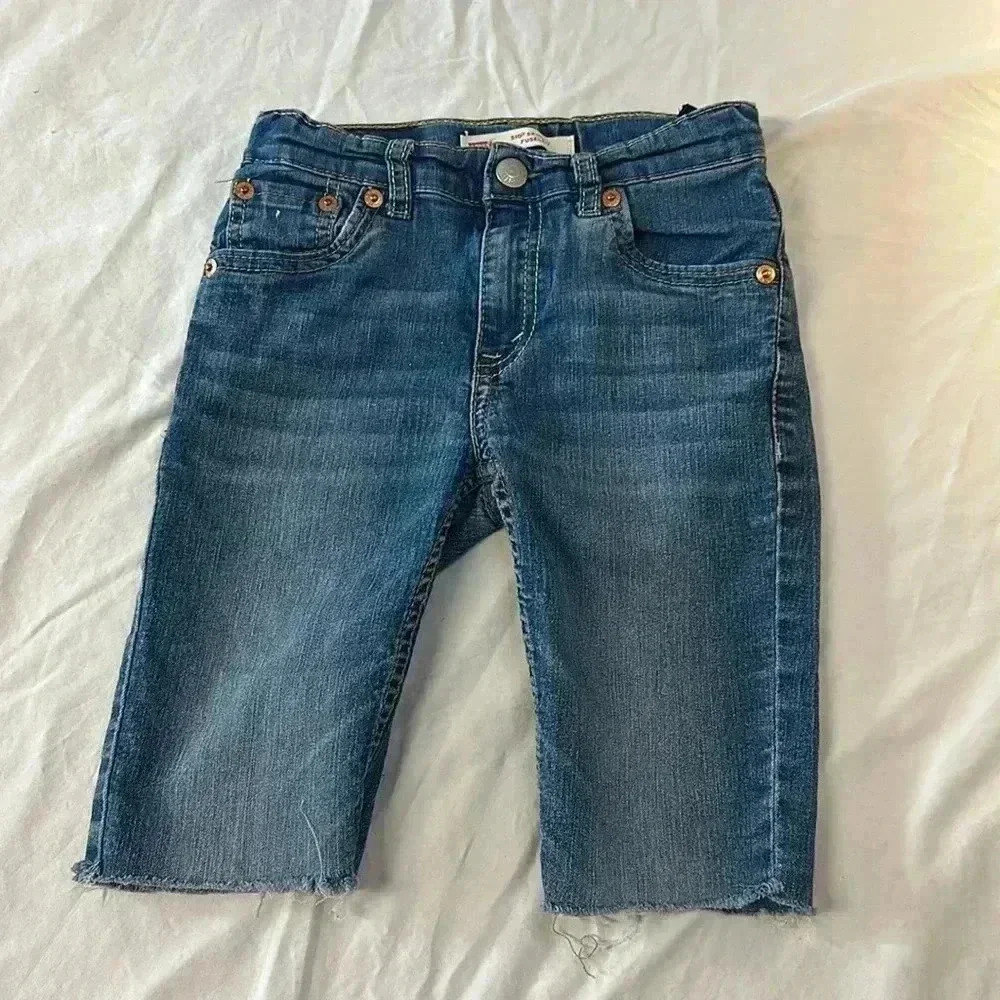 ⭐️ Levi’s - 510 long denim shorts with  frayed ham. Size 7.